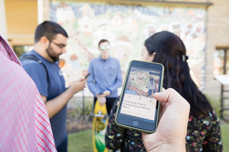 Students test a walking tour app of Hannibal Square in Winter Park, Florida.