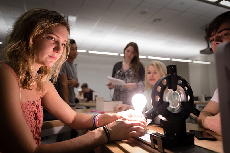 College students conduct a physics experiment in Bush Science Center at Rollins College.